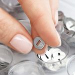 capsule-hand-with-box-and-letters-1030x686-min